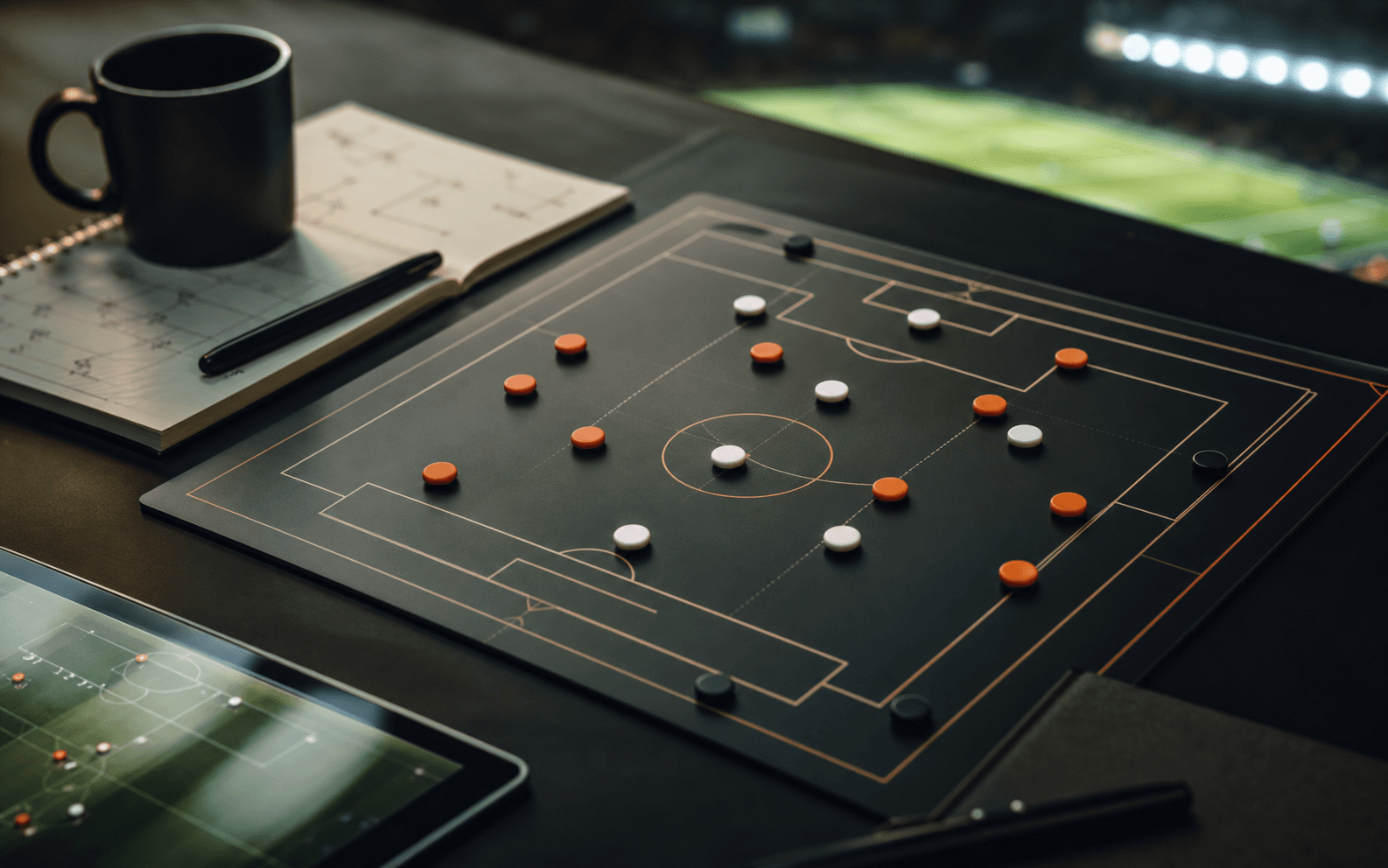 Football tactics board in a newsroom setting