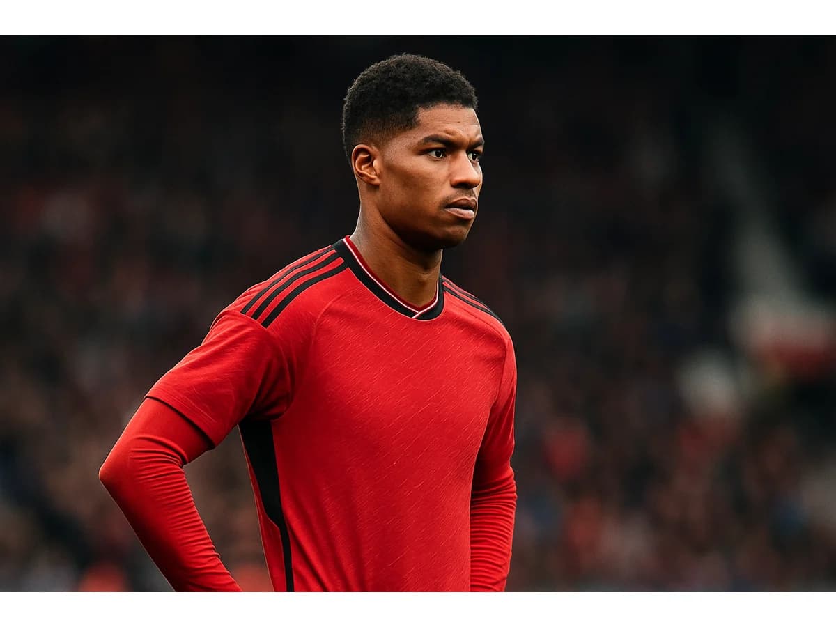 Marcus Rashford in a Manchester United kit looking thoughtful
